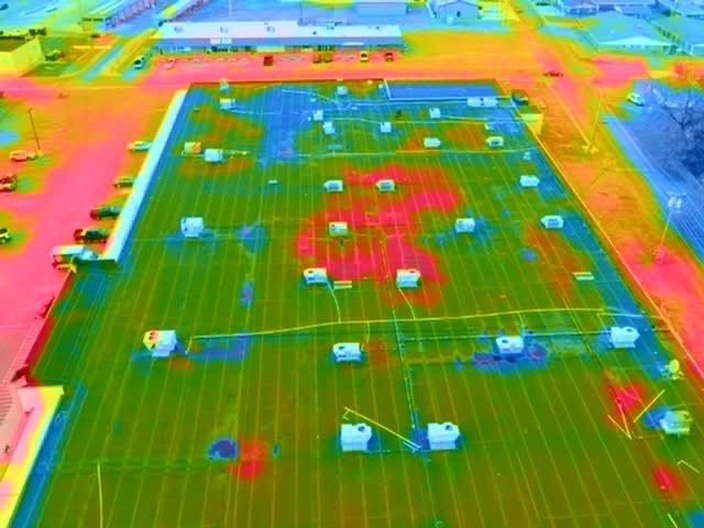 Thermal imaging drone shows energy loss on a roof