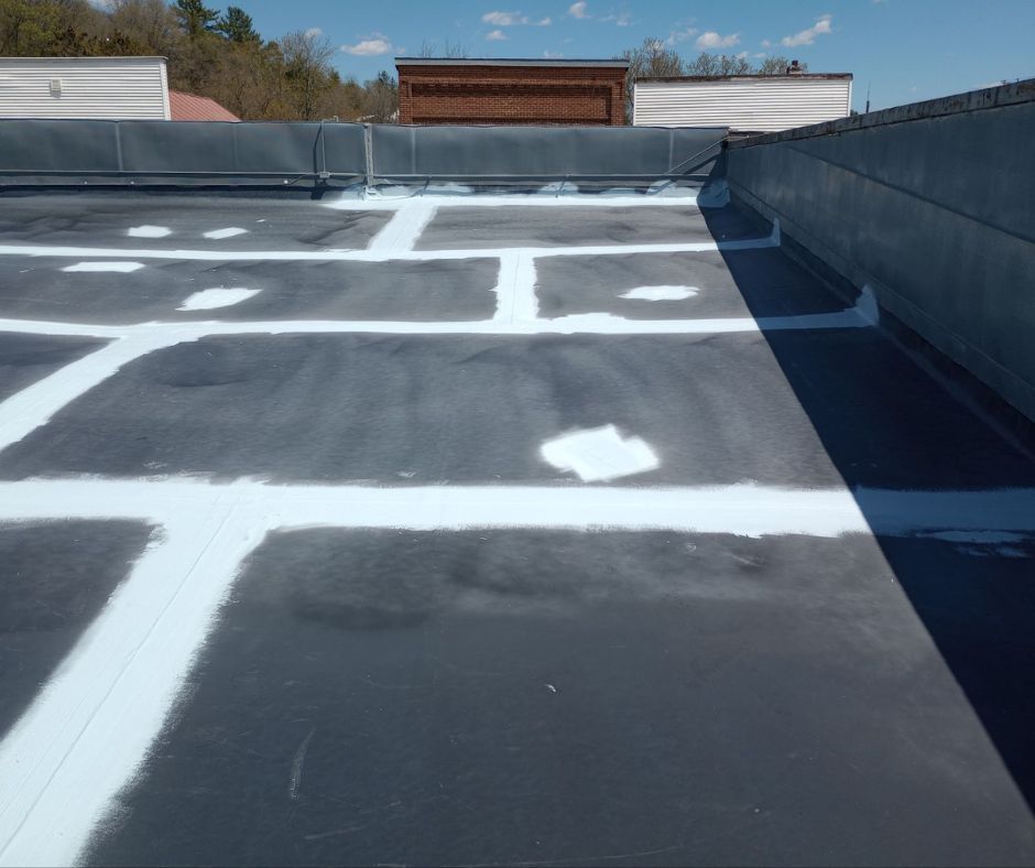 Fabric laid over seams with coatings sprayed over the fabric.