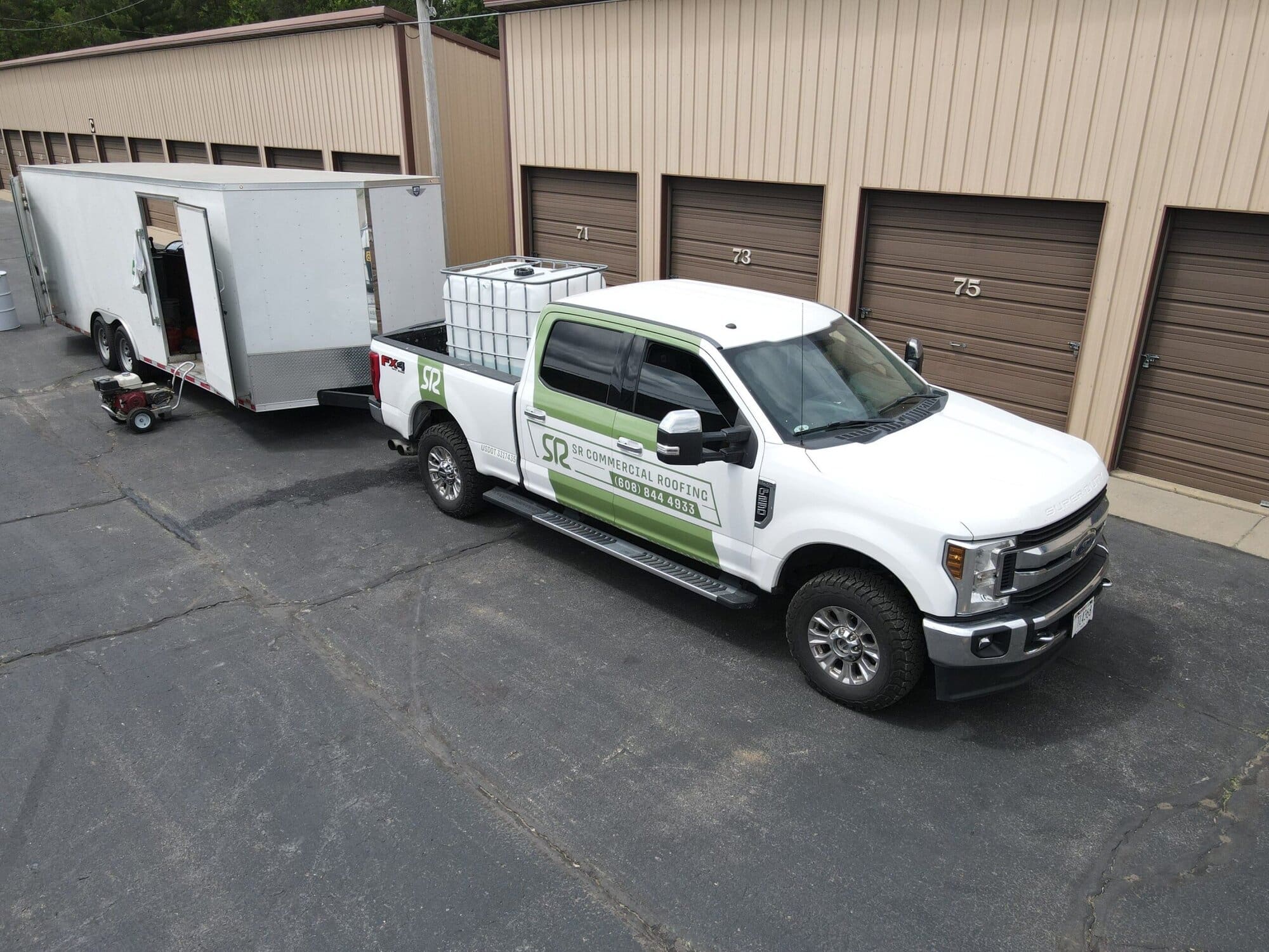 SR Commercial Roofing's truck and trailer rig.